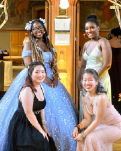 Standing left to right: Logan Gibbs-Porter ’24, Jana Williams ’24, and crouching left to right: Tracy Shi ’24, and Vicky Jiang ’24 pose for photographs at Cornell’s inaugural Pride Prom.