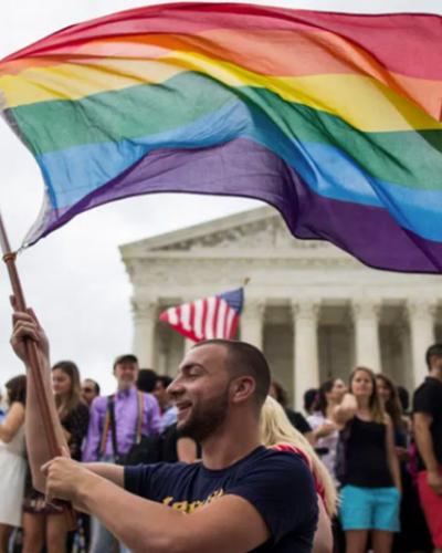 Person waving pride flag